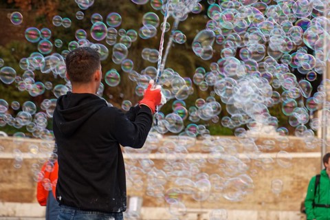 Man blowing soap bubbles