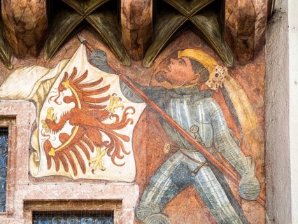 Banner bearer with armour carries white flag with red eagle
