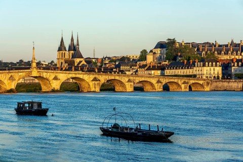 View on bridge Jacques Gabriel and the town of Blois at sunrise