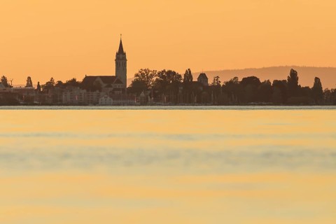 Church and harbour of Romanshorn in the evening light