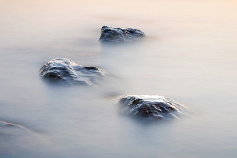 Stones in water photographed with slow shutter speed