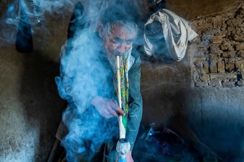 Sufi man smoking marihuana
