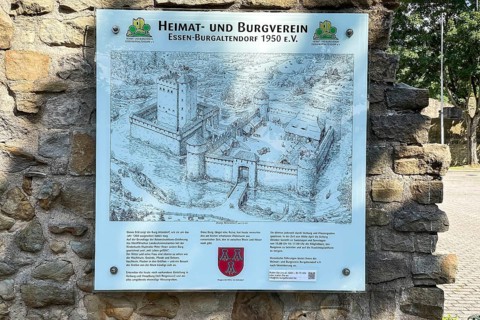 Tourist information board on ruins of partially restored Altendorf Castle from the Middle Ages