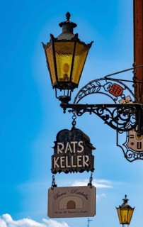 Sign from the Ratskeller and lamp
