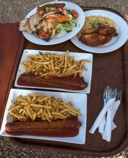 Currywurst with fries on a tray