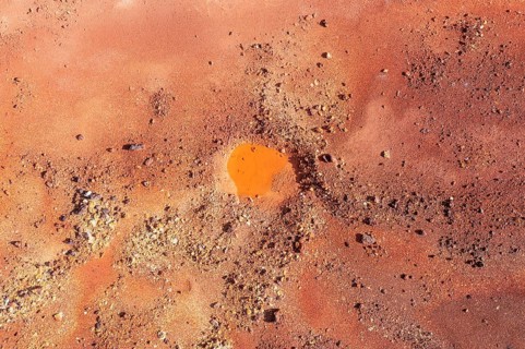 Little pool and extremely mineral-rich ground in the area of the Rio Tinto mines