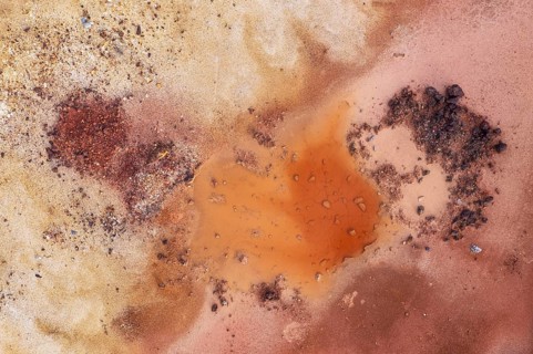 Little pool and extremely mineral-rich ground in the area of the Rio Tinto mines