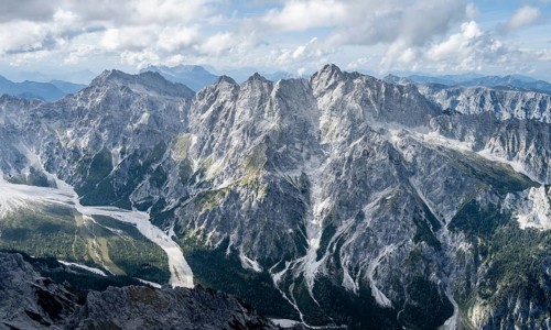 Hiker with helmet looking at mountains