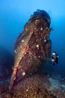 Divers at the bow of tugboat