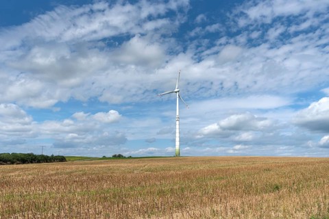 Windmill and cloudy sky