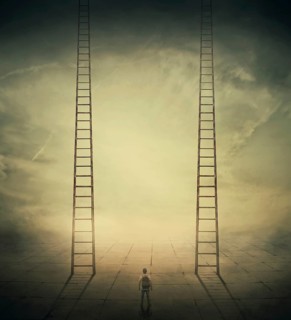 Surrealistic concept as a man standing in a foggy street looking at two stairways