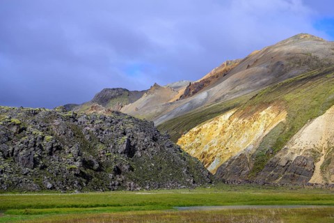 Lava field and sulphur yellow mountainside