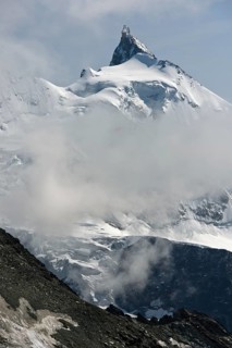 Peak Zinalrothorn rising from the sea of clouds