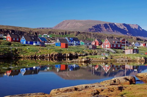 Wooden houses reflected in the water