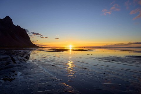 Sunrise on the beach over the sea
