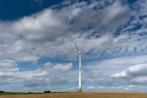 Windmill and cloudy sky