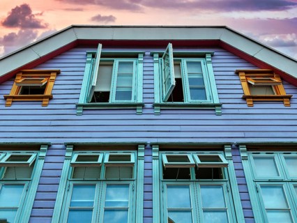 Traditional colourful wooden house in the evening