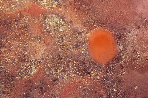 Little pool and extremely mineral-rich ground in the area of the Rio Tinto mines