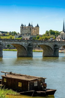 The Cessart bridge and Chateau de Saumur on river Loire
