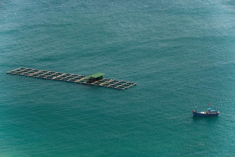 Fishing boat with fish traps in the China Sea