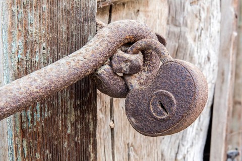 Macro view of a very old rusty padlock