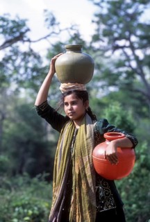 Indian girl carrying water in the jug
