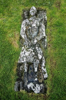 Stone grave slab of Angus Martin on the Kilmuir Cemetery
