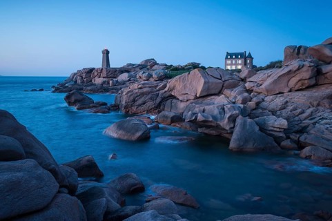 Bay with house and lighthouse