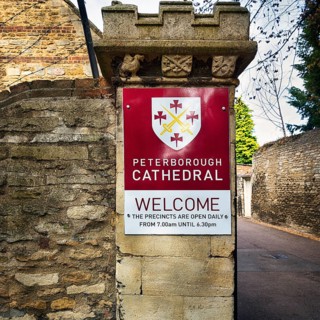 Welcome sign with coat of arms on a wall