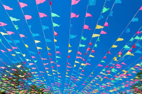 Colourful flags against the sky