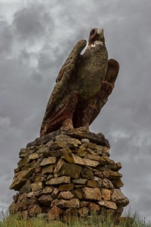 Stone eagle along the road