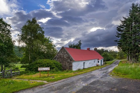 Moirlanich Longhouse 19th century lime-framed Scottish cottage with cattle shed in Glen Lochay near Killin