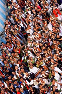 Naga tribesmen participating in the stone-pulling ceremony during the Kisima Nagaland Hornbill Festival