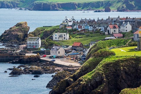 The fishing village of St Abbs seen from the south side of St Abb's Head