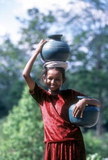 Indian girl carrying water in the jug