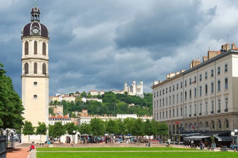 Bell tower of the former Hopital de la Charite and the Basilica Notre-Dame de Fourviere on the top of the hill