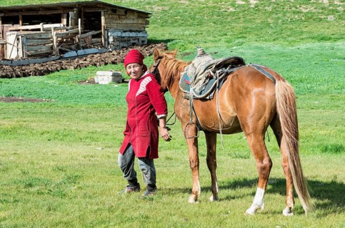Kyrgyz woman with horse