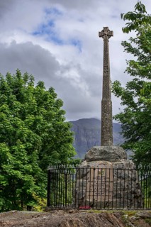 Monument with Celtic cross commemorating the massacre of the Clan MacDonald of Glencoe in 1692