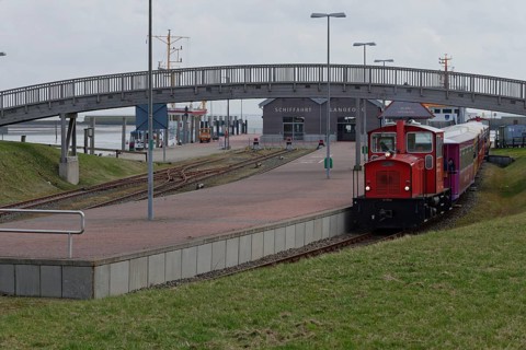 Island train leaves station at harbour