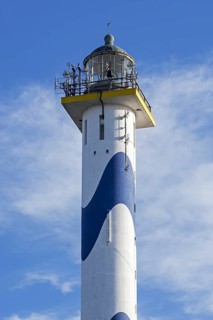 Lantern of the white-blue lighthouse Lange Nelle in the harbour of Ostend at the Belgian North Sea coast