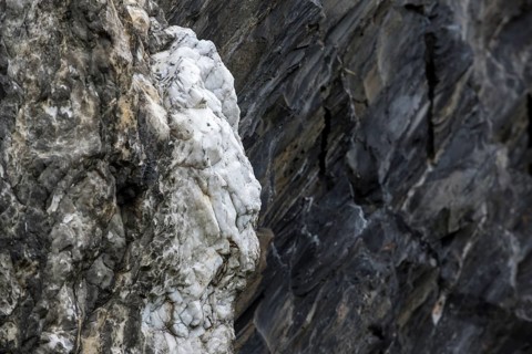 White quartz vein in rock face at Ballachulish shale quarry in Lochaber