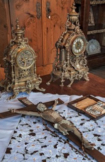 Antique grandfather clocks and crucifix