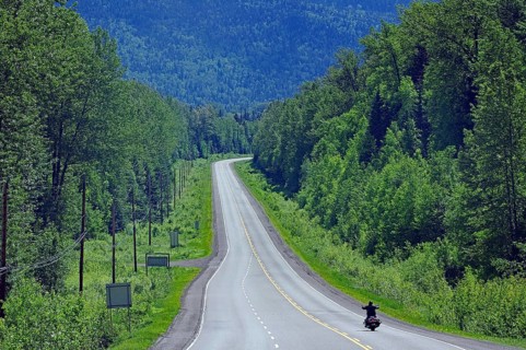 Motorcyclist on endless highway without traffic