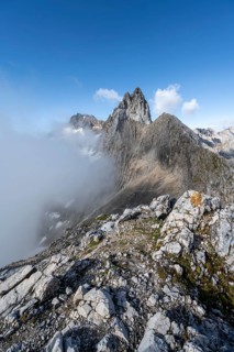 View of the solid cloud-covered summit and ridge of the Partenkirchner Dreitorspitze