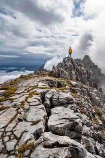 Hiker at the summit of the Westliche Toerlspitze