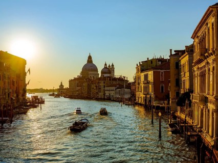 Boats in the Grand Canal at sunrise