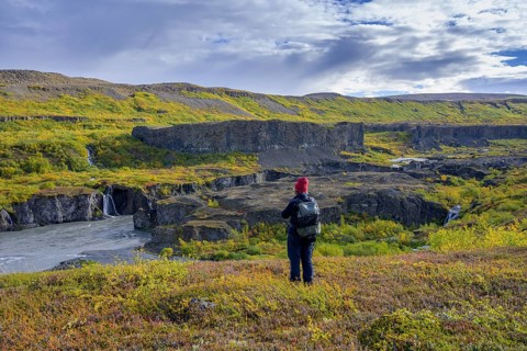 Woman looking towards the Katlar narrows of Joekulsa A Fjoellum