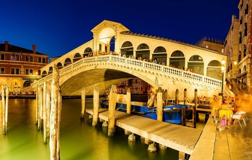 Rialto Bridge on the Grand Canal at dusk