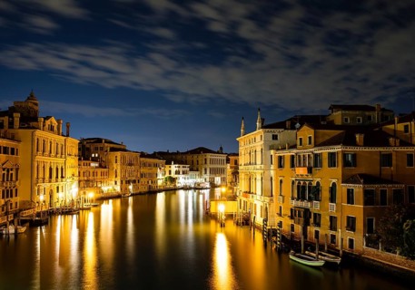 Historic house facades on the Grand Canal at night