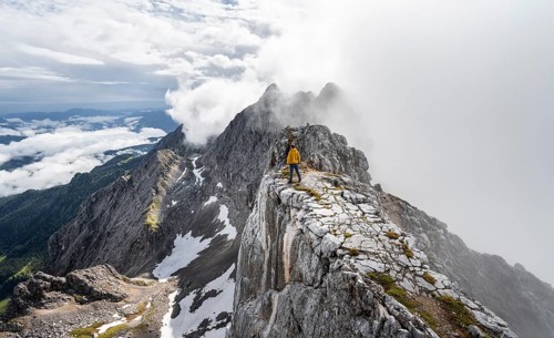 Hiker at the summit of the Westliche Toerlspitze